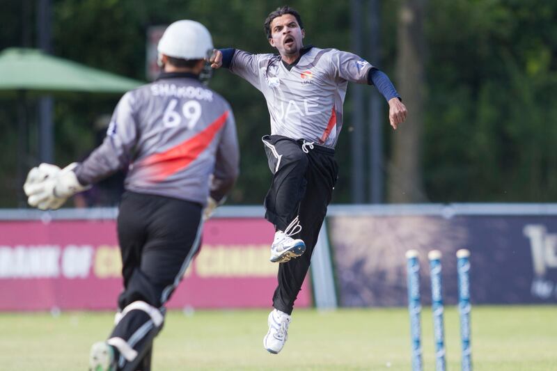 KING CITY, CANADA : August 6, 2013 UAE bowler Nasir Aziz (right) celebrates with wicketkeeper Abdul Shakoor after they combine to dismiss  Canada captain Rizwan Cheema during the one day international  at the Maple Leaf Cricket club in King City, Ontario, Canada ( Chris Young/ The National). For Sports *** Local Caption ***  chy215.jpg