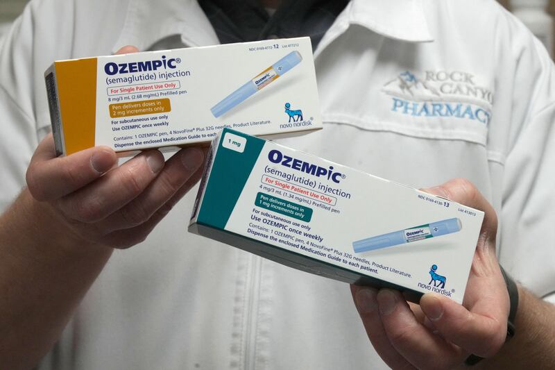 A pharmacist displays boxes of Ozempic, a drug used for treating Type 2 diabetes. Reuters