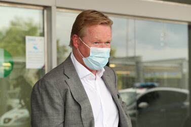 Ronald Koeman arrives at Barcelona airport on Tuesday. Reuters