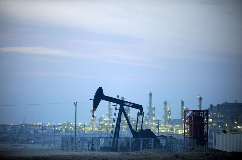 An oil pump operates in the Awali oil field in Bahrain on Wednesday, Jan. 5, 2011. Oil extended its biggest drop in seven weeks on signs that snowstorms in the U.S. curbed gasoline consumption in the world's biggest crude consumer. Photographer: Phil Weymouth/Bloomberg
