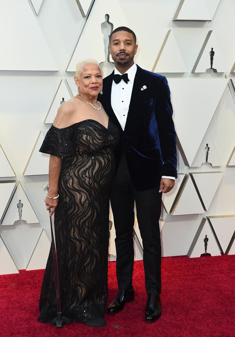 Michael B. Jordan, right, in Tom Ford and Donna Jordan at the 91st Academy Awards. AP
