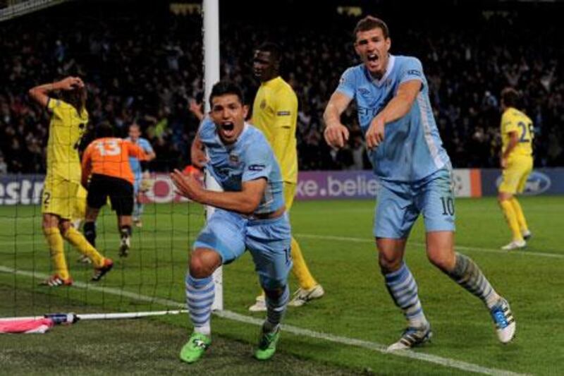 Manchester City could have been on the brink of elimination if not for a last-gasp goal from Sergio Aguero, left.