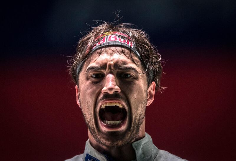 Max Heinzer of Switzerland reacts during a match in the team men's epee qualification match at the Fencing World Championships in Wuxi, China. Aleksandar Plavevski/EPA