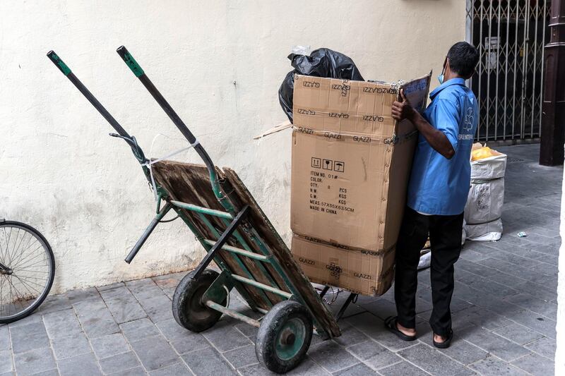 A porter pushes a trolley through the streets of Deira on June 22st, 2021. 
Antonie Robertson / The National.
Reporter: Sarwat Nasir for National