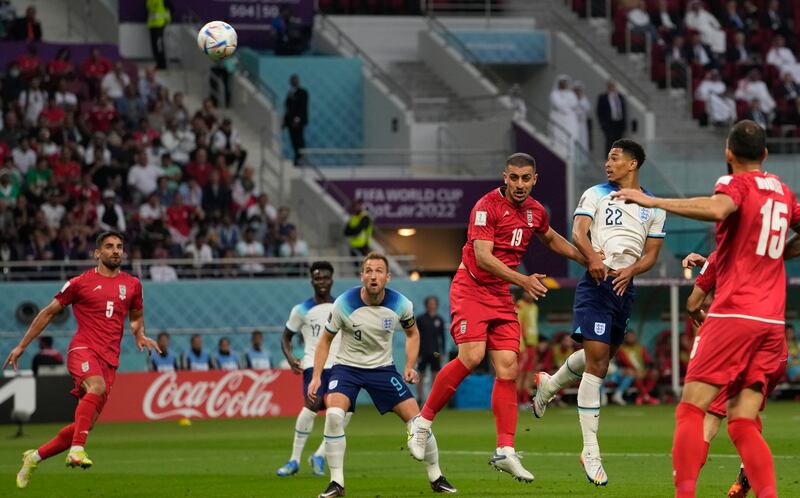 Jude Bellingham heads home for England's opener. AP