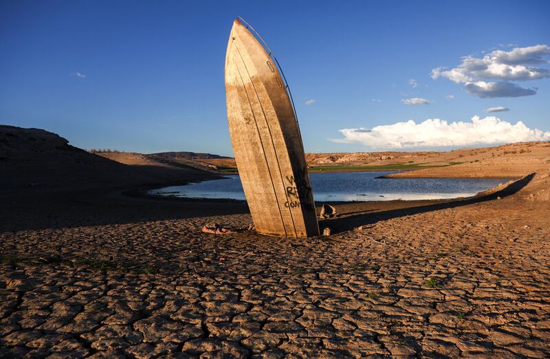 A formerly sunken boat is stuck nearly upright in a now-dry section of lakebed at drought-stricken Lake Mead. Getty