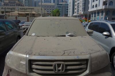 ABU DHABI, UNITED ARAB EMIRATES - - -  September 29, 2016 ---  A Honda Pilot covered in dirt and slapped with tickets sit in a parking lot near the Al Munda Primary School in Abu Dhabi. Some residents are being fined and their cars being towed away for as a result of dirty and or abandoned cars being left in parking lots around Abu Dhabi.   ( DELORES JOHNSON / The National )  
ID: 86356
Reporter: Anwar
Section: NA *** Local Caption ***  DJ-290916-Abandoned Cars-86356-010.jpg