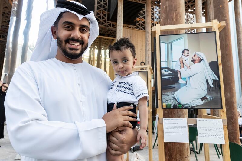 The Emirati Dads exhibition at the Swedish pavilion at Expo 2020 encourages shared parenting. Pictured is Emirati dad Abdul Rahman and his son Omar. Photos: Antonie Robertson / The National