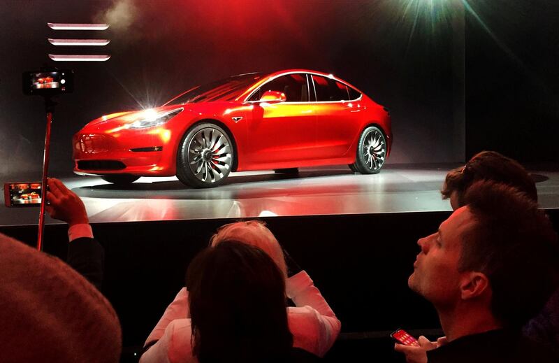 FILE PHOTO: A Tesla Model 3 sedan, its first car aimed at the mass market, is displayed during its launch in Hawthorne, California, U.S. March 31, 2016.  REUTERS/Joe White/File Photo                       GLOBAL BUSINESS WEEK AHEAD