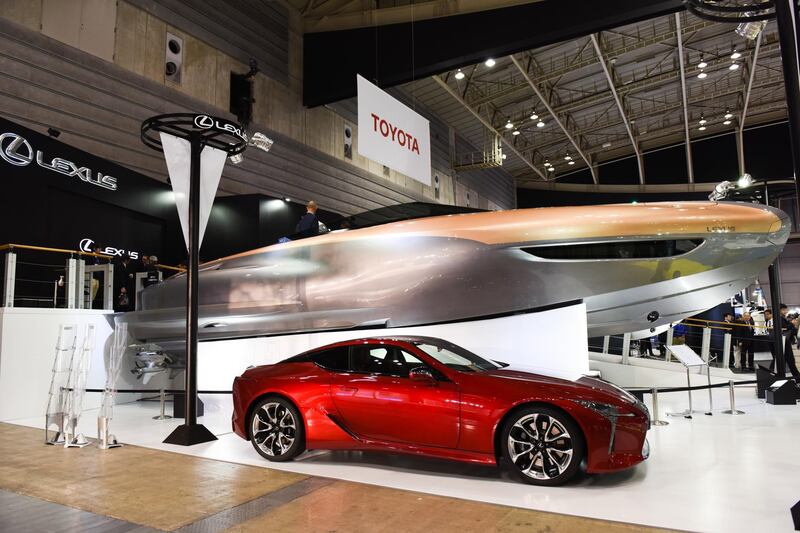 A Toyota Motor Corp. Lexus Sport Yacht Concept, above, and a Lexus LC 500 vehicle stand on display at the Japan International Boat Show in Yokoyama, Japan, on Thursday, March 8, 2018. The annual boat show organized by Japan Marine Industry Association (JMIA) run through to March 11. Photographer: Noriko Hayashi/Bloomberg