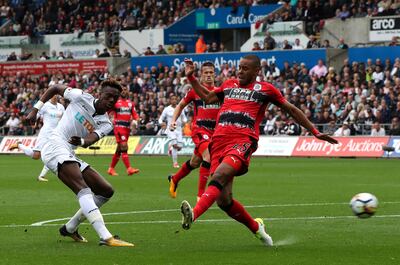 Swansea City's Tammy Abraham hits a shot towards the Huddersfield Town goal during their English Premier League soccer match at the Liberty Stadium in Swansea, England, Saturday Oct. 14, 2017. (Nick Potts/PA via AP)