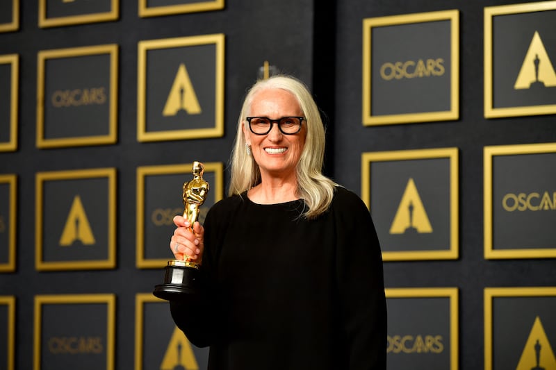 New Zealand Director Jane Campion poses with the Best Director award for 'The Power Of The Dog' in the press room. AFP