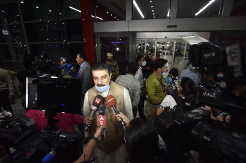 Passengers from Kabul arrive at Indira Gandhi International Airport in New Delhi, India.