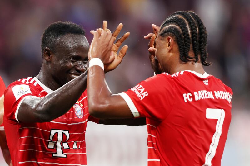 Sadio Mane celebrates scoring Bayern's second goal with teammate Serge Gnabry. Getty