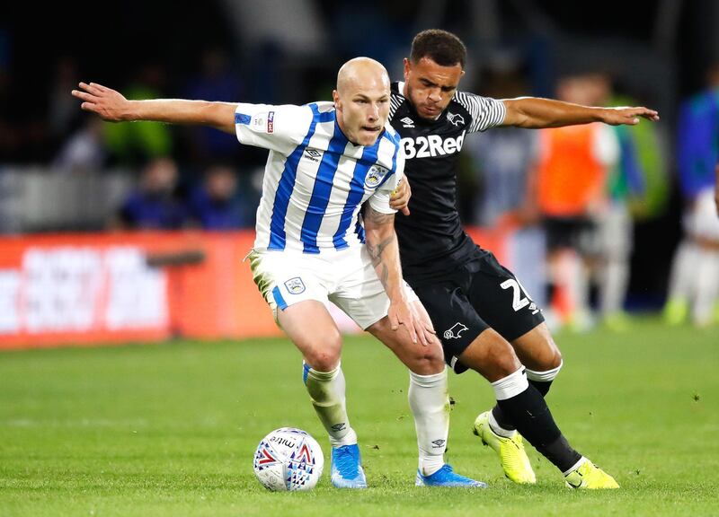 Aaron Mooy, left, is staying in the Premier League after joining Brighton and Hove Albion from relegated Huddersfield Town. PA Photo