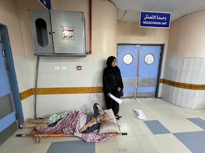 An injured Palestinian lies on a stretcher on the floor of Nasser Hospital after being evacuated from the European Hospital in Khan Younis. Reuters
