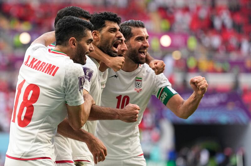 Iran's players celebrate their win over Wales at the World Cup 2022 at the Ahmad Bin Ali Stadium on Friday, November 25, 2022. AP