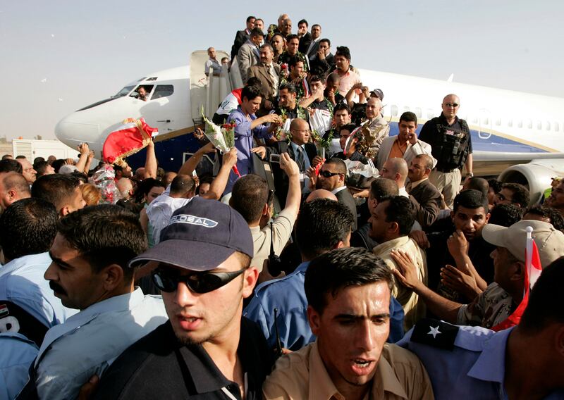 Supporters welcome members of the Iraq national football team at Baghdad International Airport on on August 3, 2007 following their victory at the 2007 Asian Cup held jointly in Indonesia, Malaysia, Thailand and Vietnam. Reuters