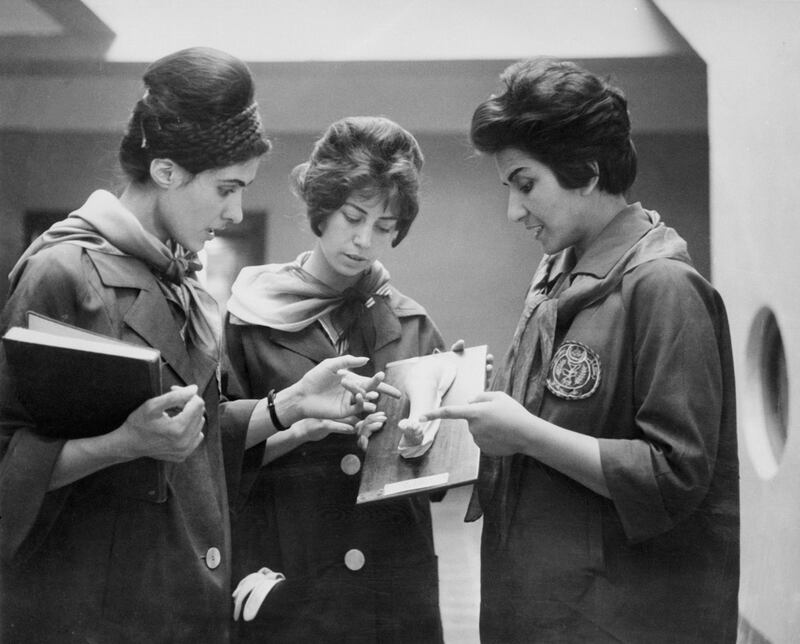 Picture taken in 1962 at the Faculty of Medecine in Kabul of two Afghan medicine students (Left and Center) listening to their Professor as they examine a plaster showing a part of a human body. / AFP PHOTO / STAFF