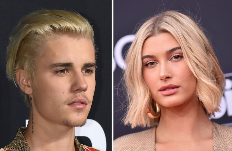 (FILES:) These two file photos show singer Justin Bieber (L) on February 10, 2016 attending the Yves Saint Laurent men's fall line at the Hollywood Palladium in Hollywood, California; and TV personality-model Hailey Baldwin (R) on May 20, 2018 at the 2018 Billboard Music Awards at the MGM Grand Resort International in Las Vegas, Nevada. Trouble-prone pop star Justin Bieber will be a married man after popping the question to model Hailey Baldwin whom he has dated for one month, reports said on Sunday, July 8, 2018. The 24-year-old Canadian heartthrob, who has become better known for his off-stage antics, proposed to the 21-year-old over dinner Saturday night at a restaurant in The Bahamas, the celebrity news site TMZ said. The site quoted witnesses at the restaurant, who said that Bieber's security team asked them all to put their phones away for the proposal. / AFP / ROBYN BECK
