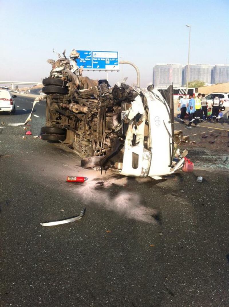 Thirteen people died and 16 were injured when a bus crashed into a truck parked on the side of Emirates Road early Saturday morning. Photo Courtesy-Dubai Security  