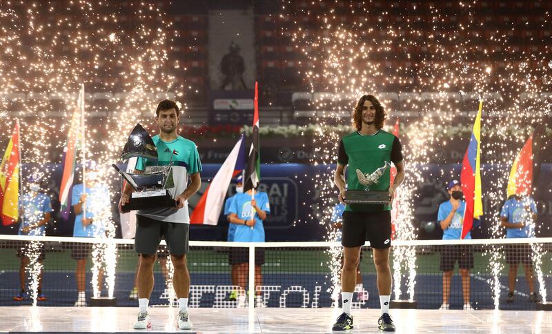 Russia's Aslan Karatsev, left, after beating Lloyd Harris of South Africa 6-3, 6-2 to win the Dubai Duty Free Tennis Championships on Saturday, March 20. Getty