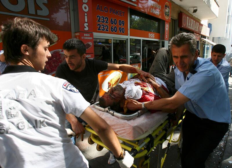 ATTENTION EDITORS - VISUALS COVERAGE OF SCENES OF DEATH AND INJURY  Medics carry a wounded man from the site of a blast in the centre of Ankara, September 20, 2011. A bomb blast rocked the centre of the Turkish capital Ankara on Tuesday and some media reports said two people were killed, while a local mayor said nobody was dead but three people were seriously wounded.    REUTERS/Stringer (TURKEY  - Tags: CONFLICT SOCIETY DISASTER) TURKEY OUT. NO COMMERCIAL OR EDITORIAL SALES IN TURKEY.   TEMPLATE OUT *** Local Caption ***  CVI168_TURKEY-EXPLO_0920_11.JPG