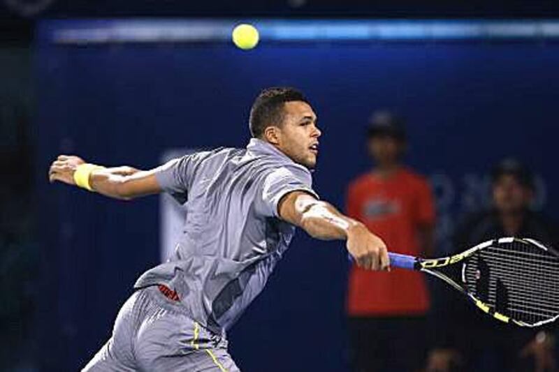 Jo-Wilfried Tsonga went down to Michael Llodra, above, for the first time in seven meetings. Ali Haider / EPA