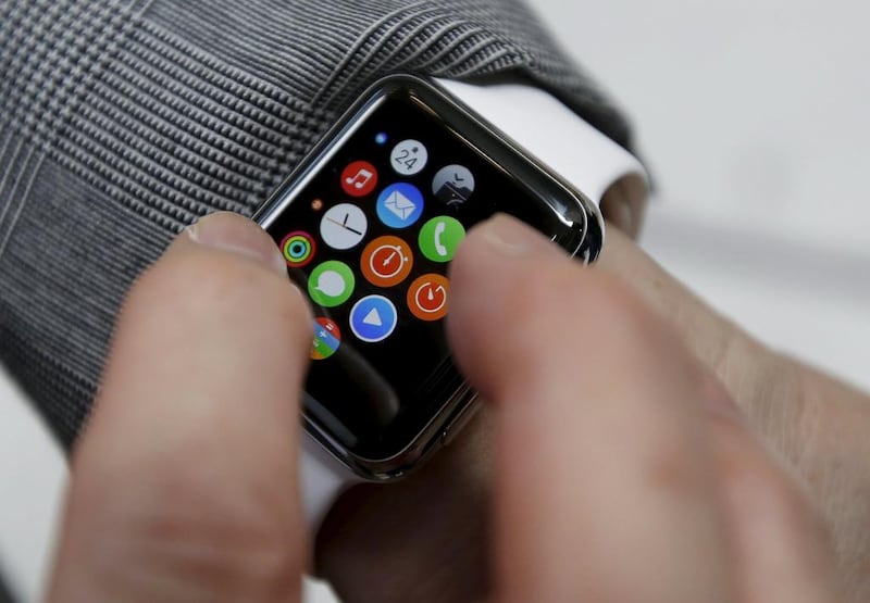 A customer uses his newly purchased Apple Watch in Tokyo (REUTERS/Issei Kato)