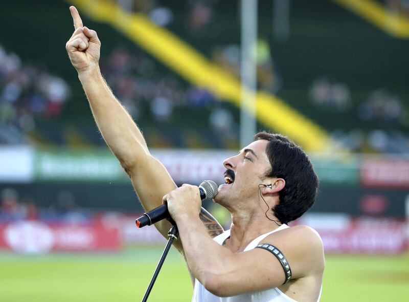 Dubai, United Arab Emirates - December 05, 2019: A Freddy Mercury impersonator sings at the HSBC rugby sevens series 2020. Thursday, December 5th, 2019. The Sevens, Dubai. Chris Whiteoak / The National