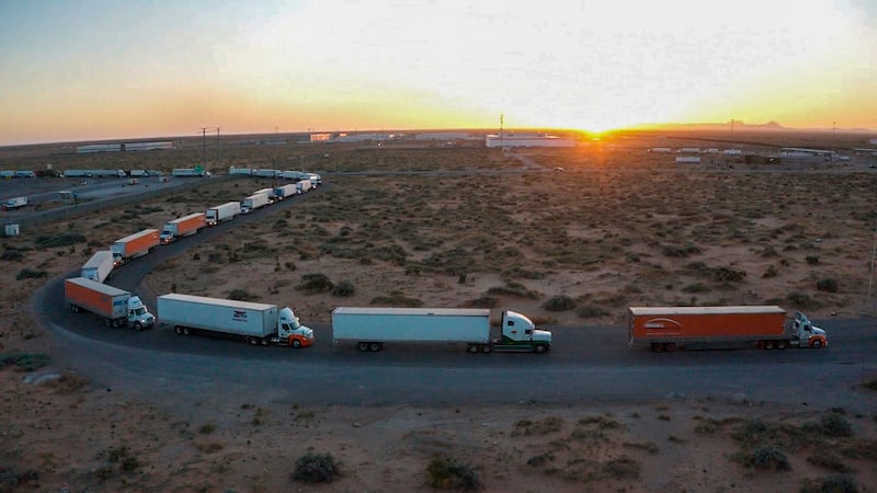Truckers block the entrance into the Santa Teresa Port of Entry in Ciudad Juarez going into New Mexico on April 12, 2022.  The truckers blocked the port as a protest to the prolonged processing times implemented by Gov.  Abbott which they say have increased from 2-3 hours up to 14 hours in the last few days.  (Omar Ornelas  / The El Paso Times via AP)