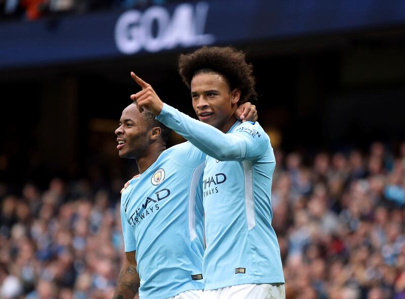 Manchester City's Raheem Sterling, left, celebrates scoring his side's second goal of the game with teammate Leroy Sane, during the English Premier League soccer match between Manchester City and Crystal Palace, at the Etihad Stadium, in Manchester, England,  Saturday, Sept. 23, 2017. (Nick Potts/PA via AP)