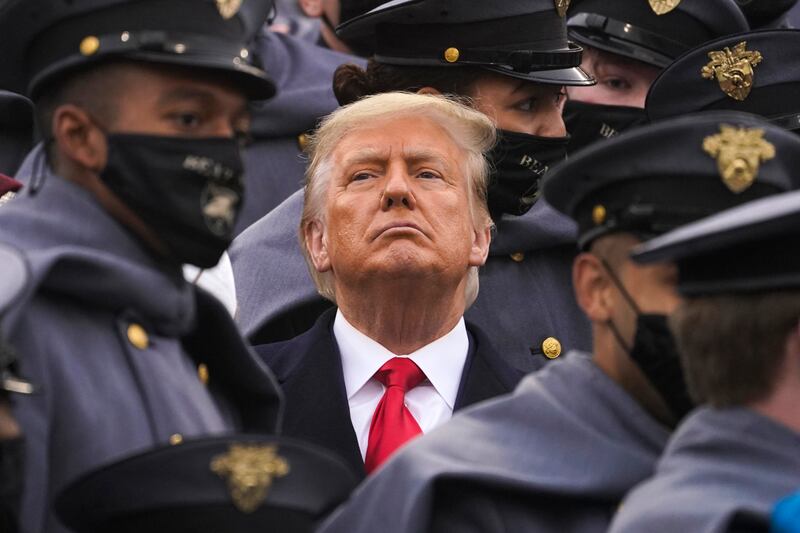 Donald Trump, pictured while he was US president in December 2020, is surrounded by military cadets as he watches an Army-Navy football game at West Point, New York. AP
