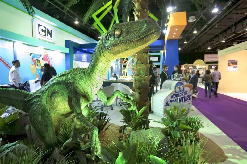 Shape of things to come: a dinosaur serves as an advertisement next to the booth of the IMG Worlds of Adventure project. Antonie Robertson / The National