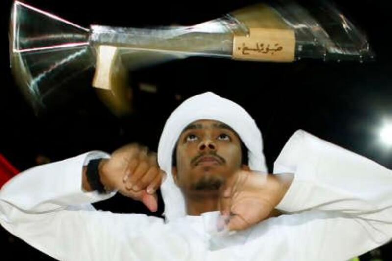 ABU DHABI, UNITED ARAB EMIRATES - June 26, 2008: Saleh Al Ameri, 18 demonstrates Al Yoolah Dance, a traditional dance of the Emirates at Summer in Abu Dhabi which opened today at the Abu Dhabi National Exhibition Centre, and will run until August 18. ( Ryan Carter / The National )