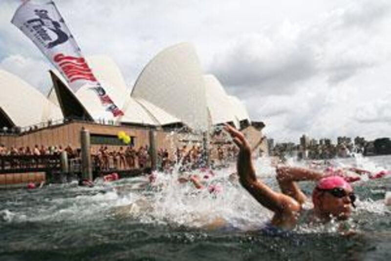 Competitors take part in the eighth annual Sydney Harbour Swim competition today, despite news of a third shark attack in three weeks.