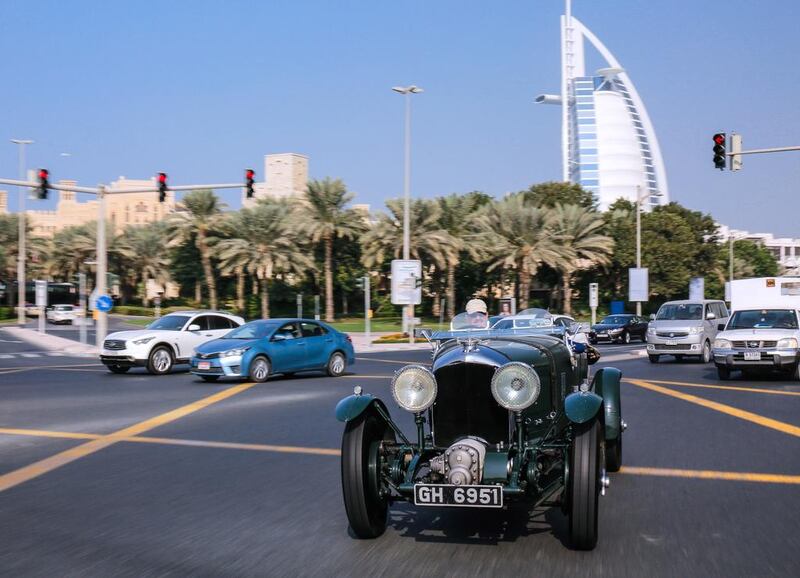 Bentley’s 4 1/2 Litre supercharged Blower, driven by brand ambassador Richard Charlesworth, on the streets of Dubai, with the Burj Al Arab in the background. Victor Besa for The National