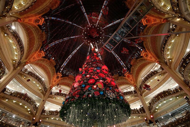 A giant Christmas tree stands at Galeries Lafayette department in Paris, France. Reuters