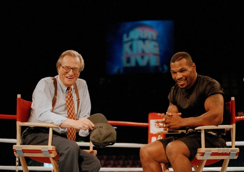 Larry King with former heavyweight champion Mike Tyson on a broadcast of Larry King Live from inside the ring at the MGM Grand Gardens in Las Vegas on August 16, 1995. AP Photo