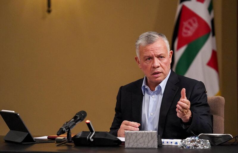 A handout picture released by the Jordanian Royal Palace on May 9, 2021 shows Jordanian King Abdullah II during a meeting with private sector representatives over corporate social responsibility initiatives to support local communities, in the capital Amman.  - RESTRICTED TO EDITORIAL USE - MANDATORY CREDIT "AFP PHOTO / JORDANIAN ROYAL PALACE / YOUSEF ALLAN" - NO MARKETING NO ADVERTISING CAMPAIGNS - DISTRIBUTED AS A SERVICE TO CLIENTS
 / AFP / Jordanian Royal Palace / Yousef ALLAN / RESTRICTED TO EDITORIAL USE - MANDATORY CREDIT "AFP PHOTO / JORDANIAN ROYAL PALACE / YOUSEF ALLAN" - NO MARKETING NO ADVERTISING CAMPAIGNS - DISTRIBUTED AS A SERVICE TO CLIENTS
