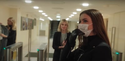 Anne Hathaway wears a mask in a scene from 'Locked Down'. YouTube