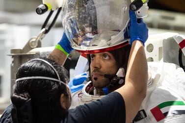 Sultan Al Neyadi prepares for spacewalk training under water. Mr Al Neyadi was one of two people selected from 4,022 candidates to become the first Emirati astronauts. MBRSC