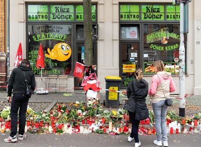 11 October 2019, Saxony-Anhalt, Halle (Saale): At a mast in front of the Kiez-DÃ¶ner there are fan scarves of football clubs and a flag of the Halleschen FC attached, in front of it there are flowers and candles. One of the victims of the attack was a member of the HFC fan club. During attacks in the middle of Halle an der Saale in Saxony-Anhalt two people were shot dead on 09.10.2019. Photo: Soeren Stache/dpa-Zentralbild/dpa (Photo by Soeren Stache/picture alliance via Getty Images)