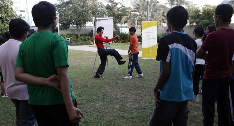 A self-defence workshop for youngsters takes place in a park in Dubai. Bullying in schools is worryingly common, according to a new study (Jeffrey E Biteng / The National)