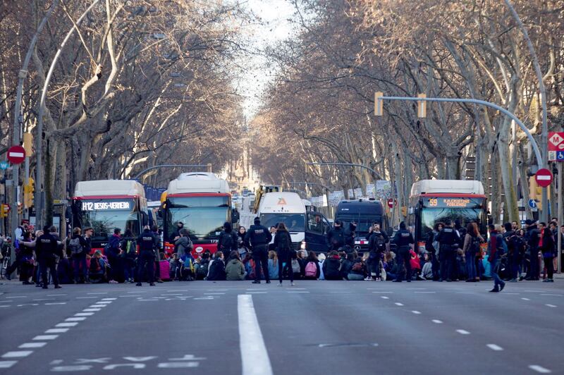 Women stage a sit-in protest blocking Gran Via avenue to mark International Women's Day, in Barcelona.  EPA