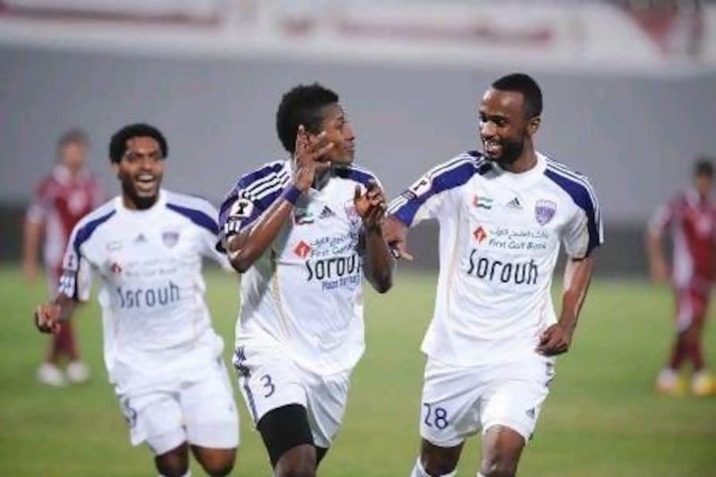 Asamoah Gyan, centre, has had plenty of success in his first season at Al Ain.