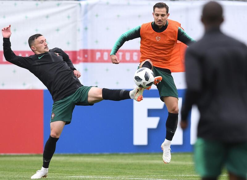 Rui Mario, left, and Cedric Soares take part in a training session for Portugal. Francisco Leong / AFP