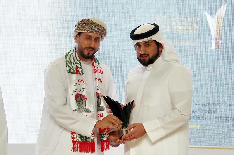 DUBAI , UNITED ARAB EMIRATES , JAN 08 – 2018 :- Sheikh Ahmed Bin Mohammed Bin Rashid Al Maktoum giving award to ENG. Abdullah Nasser Al-Saaidi , CEO of Nafath Renewable Energy from Oman during the award giving ceremony of Mohammed Bin Rashid Award for Young Business Leaders held at Dubai World Trade Centre in Dubai.  (Pawan Singh / The National) For News. Story by Caline Malek