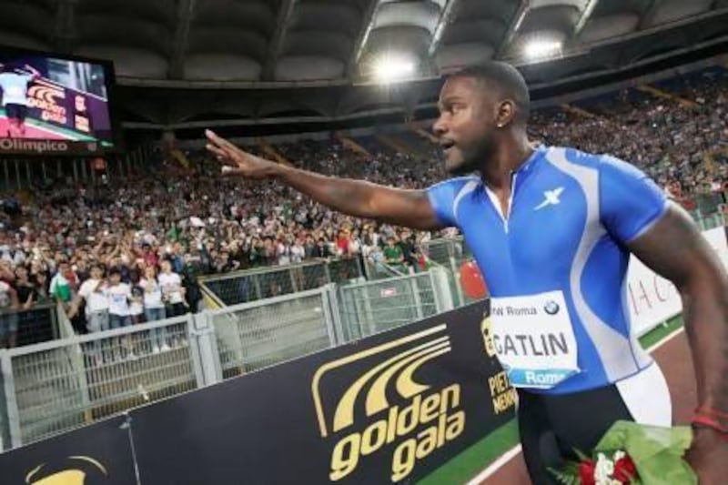 American sprinter Justin Gatlin celebrates after beating Jamaica’s Usain Bolt and winning the men’s 100m event at the Golden Gala IAAF track meet in Rome on Thursday. Andrew Medichini / AP Photo