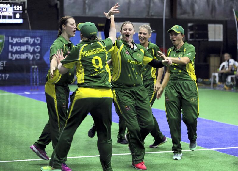 Australia players celebrate after scoring a point against South Africa during the women's final match at the Indoor Cricket World Cup, Saturday, Sept. 23, 2017, in Dubai, United Arab Emirates. (AP Photo/Kamran Jebreili)